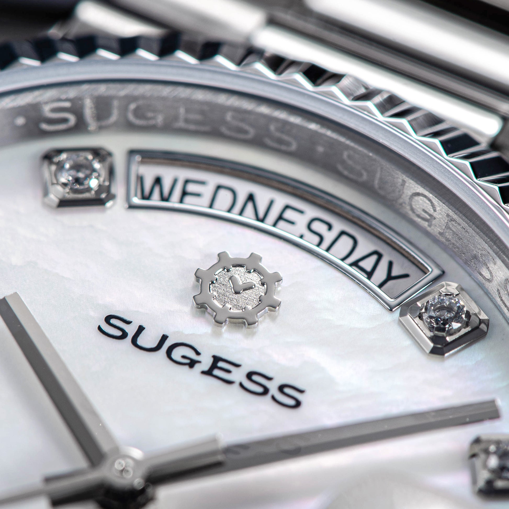 Close-up of Sugess 449-DD36 S449.06 watch face with day indicator showing Wednesday, adorned with diamond markers and a sapphire crystal.