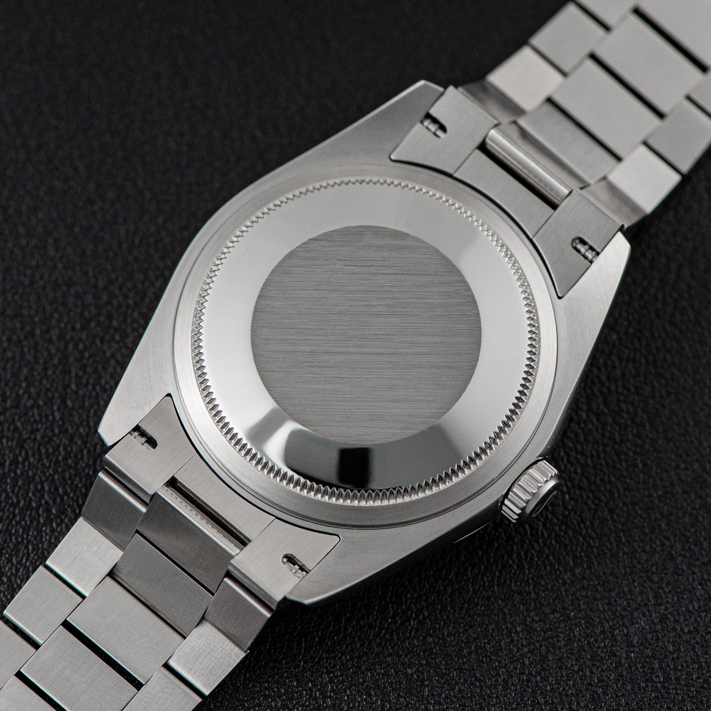 Back view of Sugess 449-DD36 S449.06 watch featuring 316L stainless steel case and band with folding clasp.